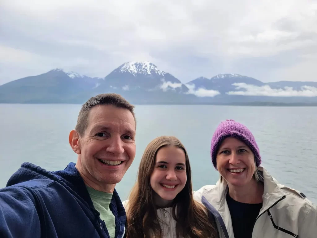 Our Alaska Cruise Was Incredible… But One Thing Left Me Cold - Jim, Faith, and Lisa on the balcony