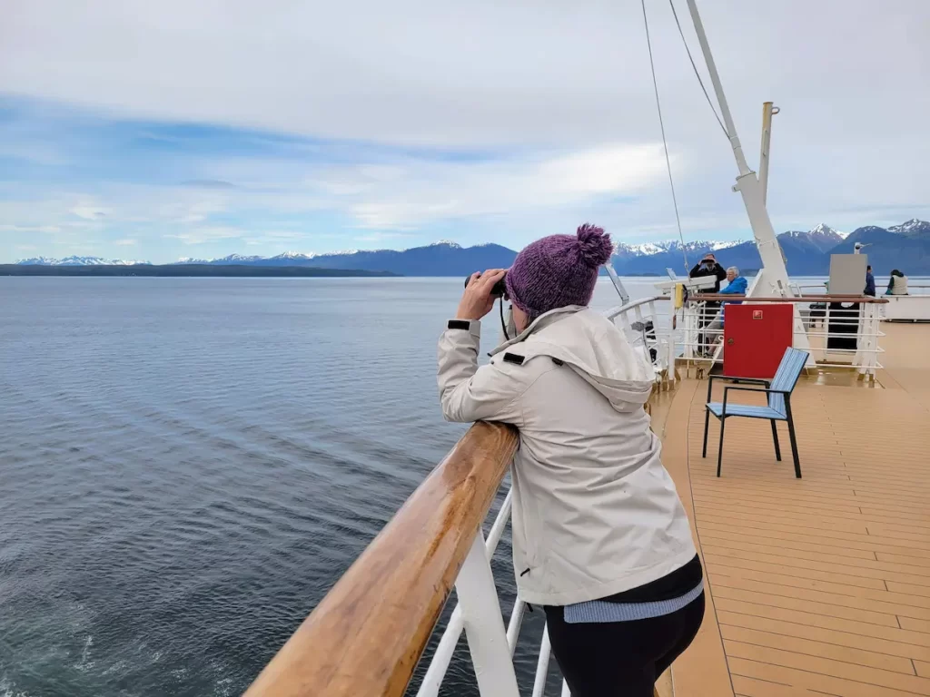 Our Alaska Cruise Was Incredible… But One Thing Left Me Cold - Lisa looking for wildlife