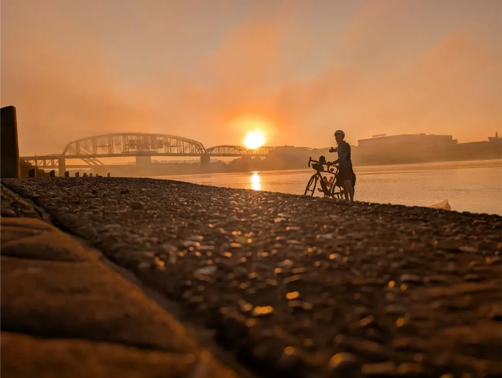 Dipping my rear bike tire in the Ohio River in Cincinnati, Ohio