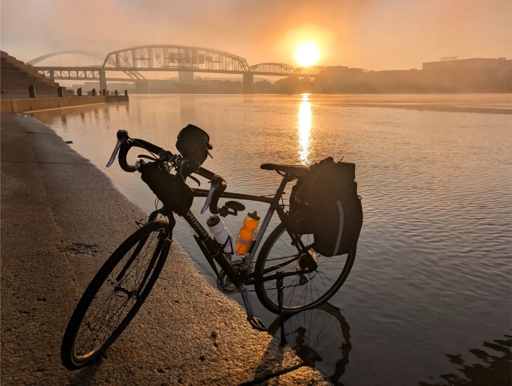 Dipping my rear bike tire in the Ohio River in Cincinnati, Ohio