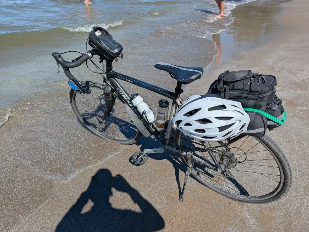 Dipping my front bike tire in Lake Erie and Edgewater Park in Cleveland, Ohio