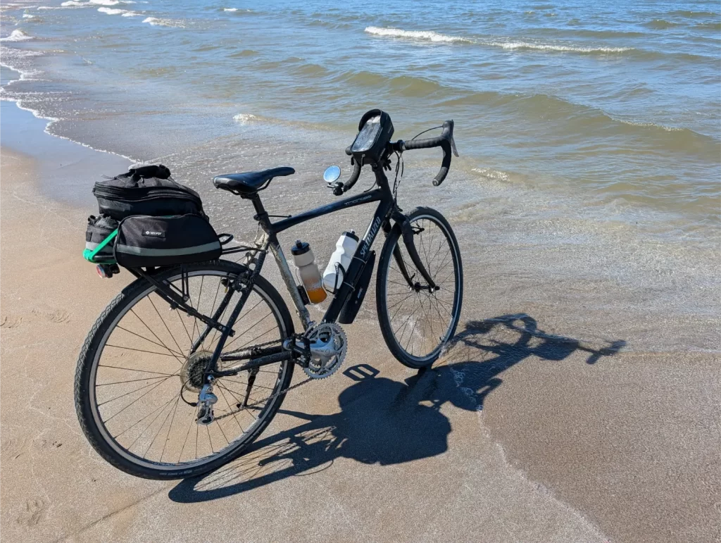 Dipping my front bike tire in Lake Erie and Edgewater Park in Cleveland, Ohio