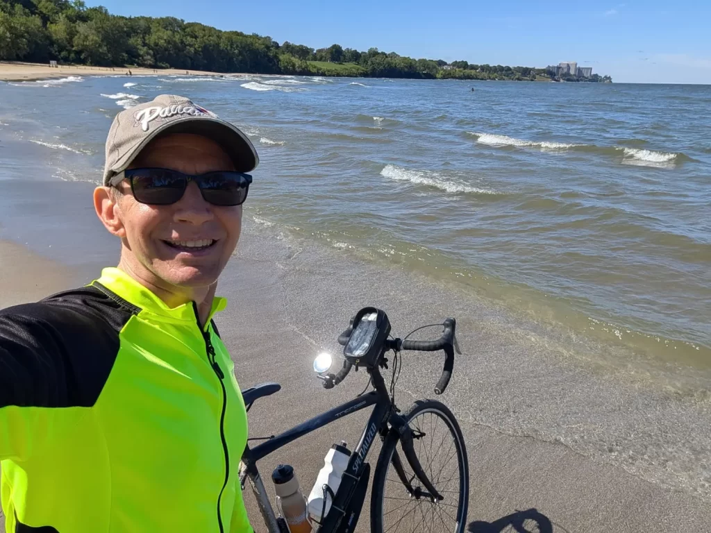 Dipping my front bike tire in Lake Erie and Edgewater Park in Cleveland, Ohio