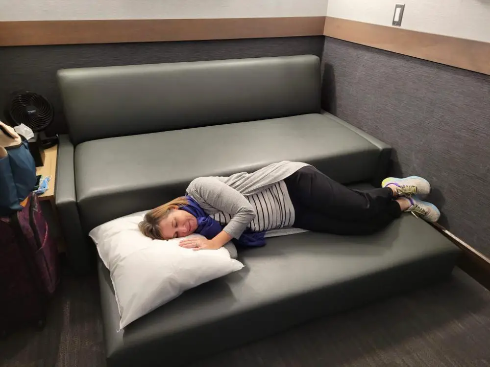 A Travel Nightmare: Free Airport Lounge Access to the Rescue! - Lisa napping