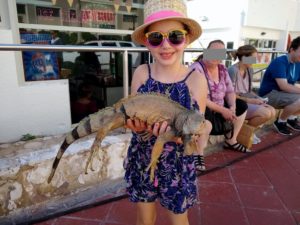 Faith holding a lizard while in Puerto Rico