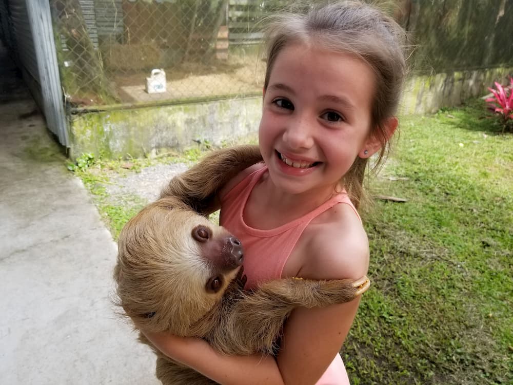 Faith Holding a Sloth