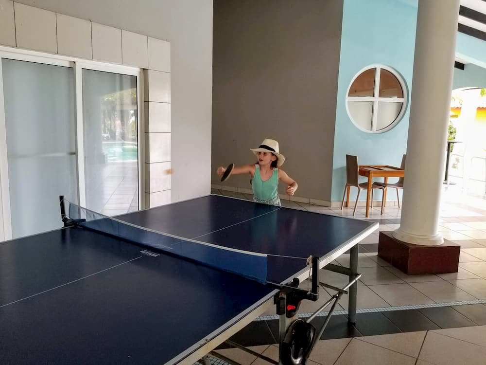 A Beach Vacation Totaling 5? Yes, Please! - Faith Playing Table Tennis