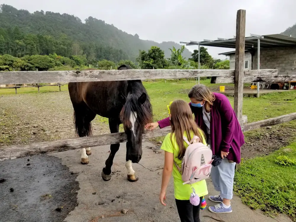 Boquete Panama – What’s It Like Today? - Faith and Lisa petting a horse