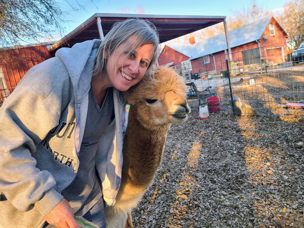 Our 9-Month RV Adventure: The 55+ Essential Items We Bought for the Road - Lisa and an alpaca