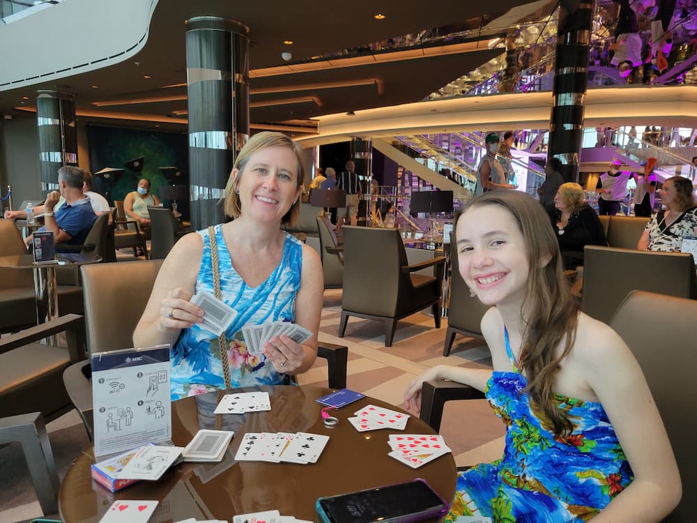 Cruise Vacations – My 3 Rules and My 3 Favorite Indulgences - Lisa and Faith - Playing Rummy on the MSC Seashore cruise ship