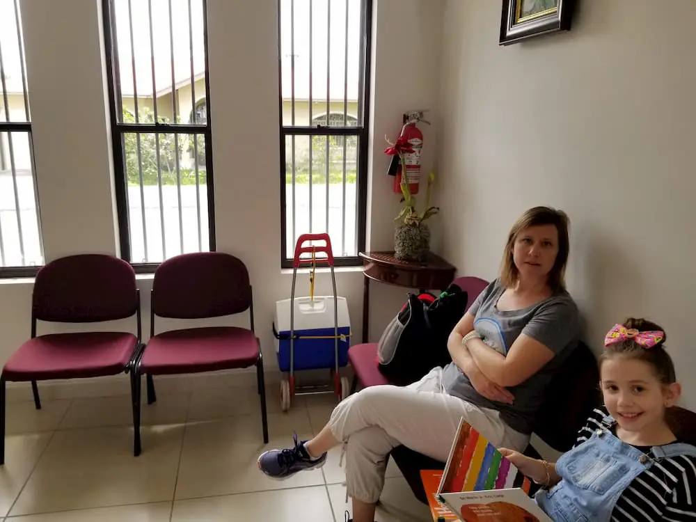 Our First Visit to the Dentist in Panama Was… Different - Lisa and Faith in the Waiting Room
